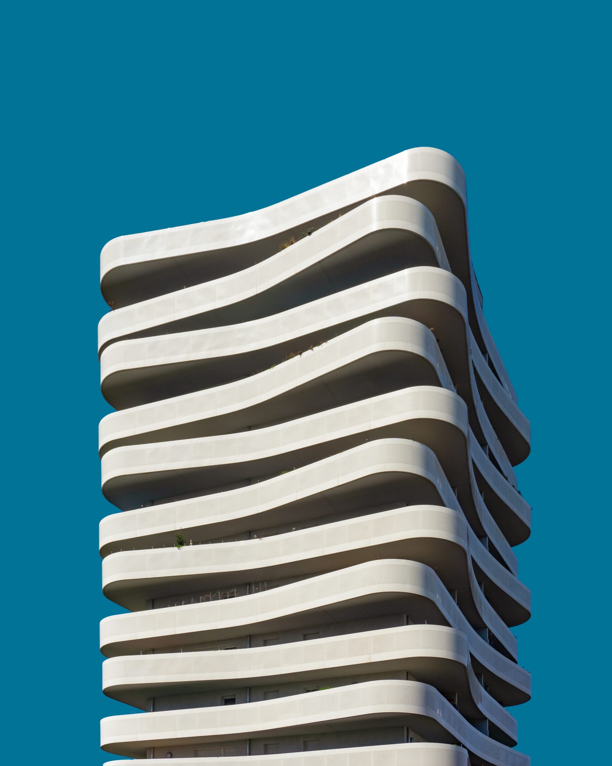 Services 8 A vertical low angle shot of a beautiful exotic white building under the blue sky